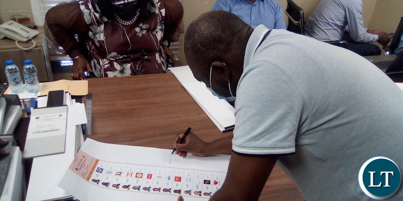 PF Deputy National Chairperson Davis Chama pending signature presidential ballot sheet in Dubai, UAE