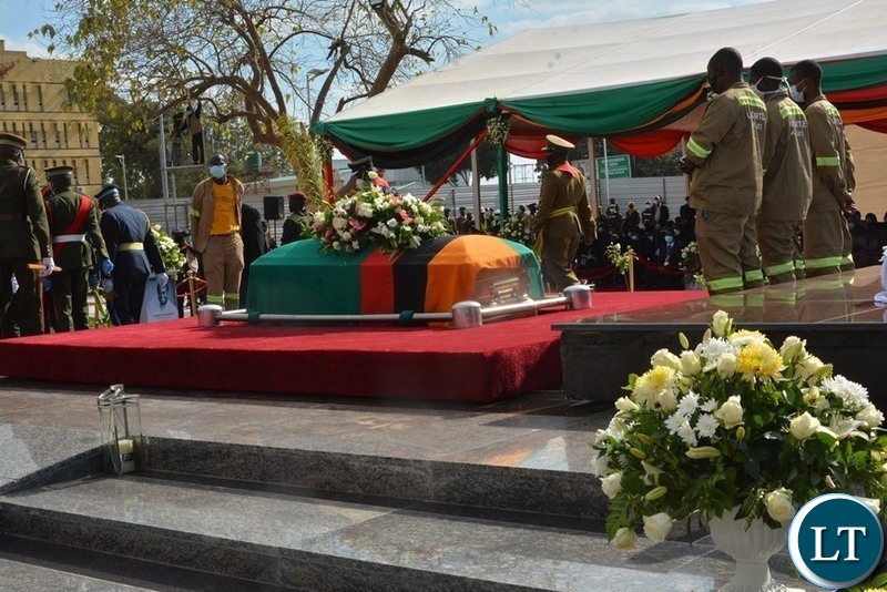Lowering the casket of the late President  into his resting place 