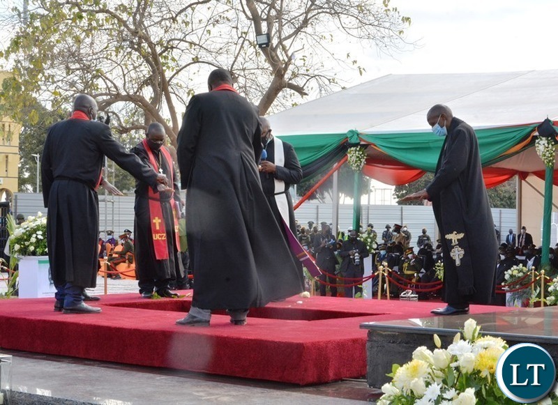 Clergymen blessing the grave of the late President Dr Kenneth Kaunda