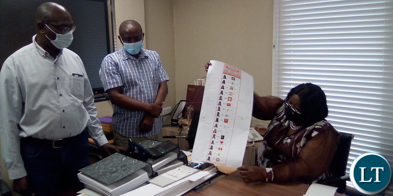 ECZ Vice Chairperson Emily Sikazwe showing ballot print sheet for presidential candidate before commencement of printing to stakeholders