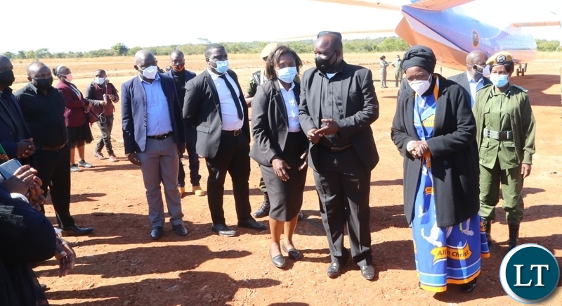 Vice President Inonge Wina being welcomed by Muchinga Permanent Secretary Captain rtd Davison Mulenga at Muchinga Airtrip during the arrival of the remains of the late first Zambian President Kenneth Kaunda