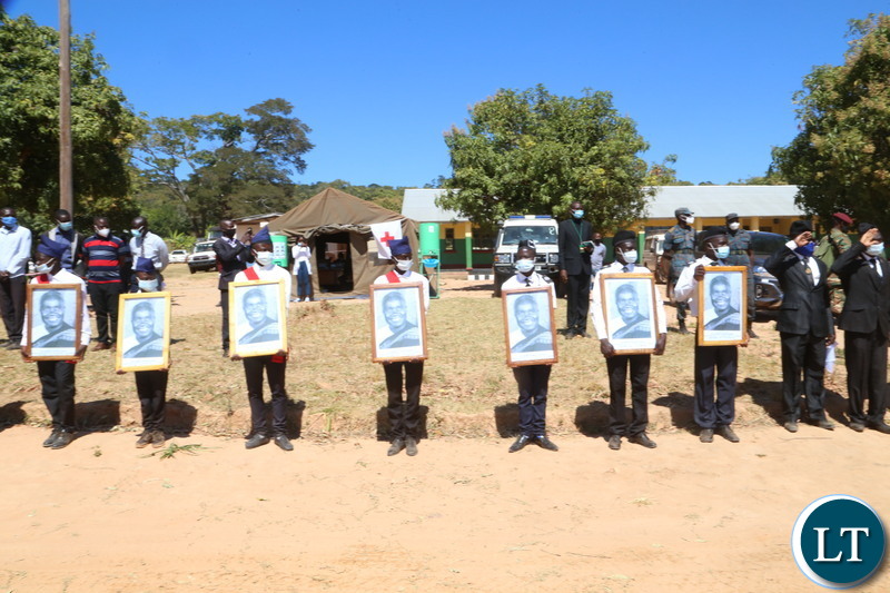 Boys Brigade with photo portraits of Kaunda welcomes the remains of the late first Zambian President Kenneth Kaunda during the arrival of the remains of the late first Zambian President Kenneth Kaunda at Lubwa mission school ground in muchinga