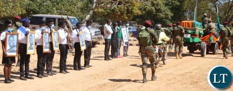 Boys Brigade with photo portraits of Kaunda welcomes the remains of the late first Zambian President Kenneth Kaunda during the arrival of the remains of the late first Zambian President Kenneth Kaunda at Lubwa mission school ground in muchinga
