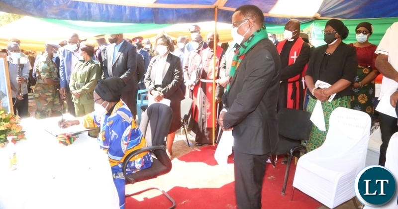 Vice President Inonge Wina singing the book condolences during the funeral service of the late first Zambian President Kenneth Kaunda at lubwa mission school ground in Chinsali 