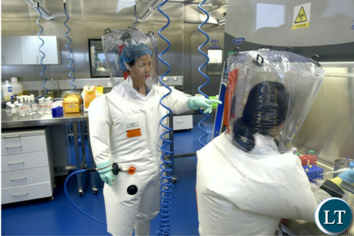 A virologist works with her colleague in the P4 lab of the Wuhan Institute of Virology, in Wuhan, in central China’s Hubei province, in 2017. A virologist works with her colleague in the P4 lab of the Wuhan Institute of Virology, in Wuhan, in central China’s Hubei province, in 2017.