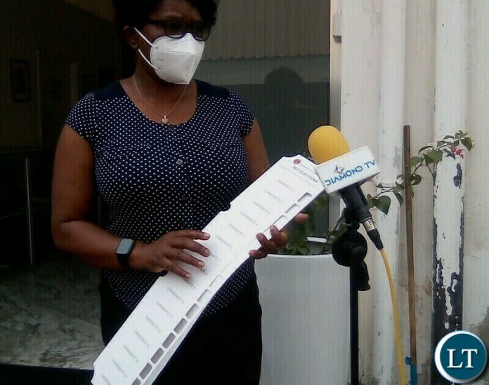 NGOCC Executive Director Engwase Mwale with braille bracket