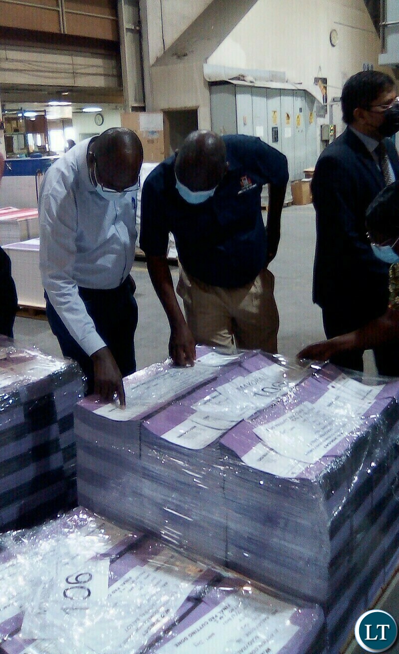 PF Vice National Chairperson Davis Chama(left) and ECZ Commissioner Ret.Major.Gen Vincent Mukanda check on printed ballot papers