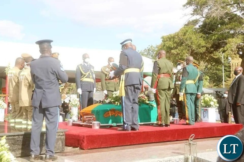 Lowering the casket of the late President  into his resting place 