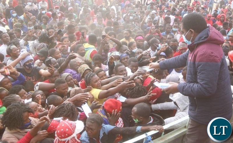HH distributing face masks to people in Lusaka's Meanwood Ndeke area.