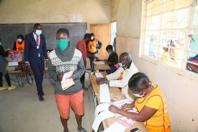 -Polling assistants verifying the names of voters at Kamulanga Primary School in Kabwata Constituency -Polling assistants verifying the names of voters at Kamulanga Primary School in Kabwata Constituency