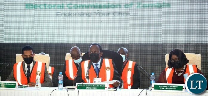 ECZ Chairperson Hon Justice Esau Chulu flanked by ECZ Chief Executive Officer Patrick Nshindano (l) and ECZ Vice Chairperson Dr. Emily Sikazwe during the Electoral Commission of Zambia announcement of results at the National Results Center Mulungushi in Lusaka ECZ Chairperson Hon Justice Esau Chulu flanked by ECZ Chief Executive Officer Patrick Nshindano (l) and ECZ Vice Chairperson Dr. Emily Sikazwe during the Electoral Commission of Zambia announcement of results at the National Results Center Mulungushi in Lusaka