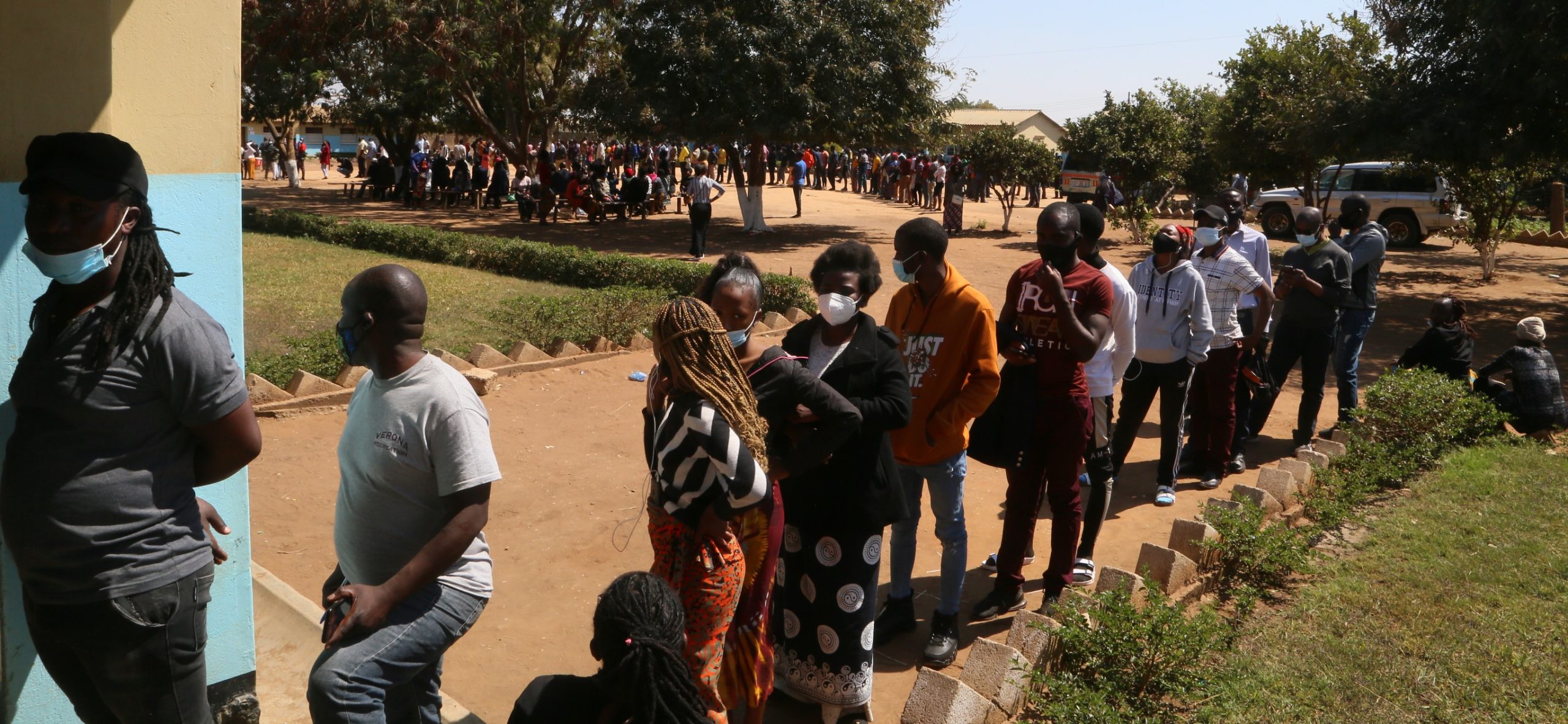 Thousands of people queue to cast their votes at Kamulanga Primary School in Kabwata Constituency