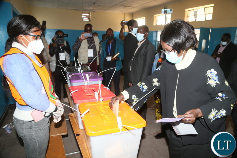 Vice President Inonge Wina getting her NRC after received a ballot paper from the polling assistant at silverest polling in Chongwe District
