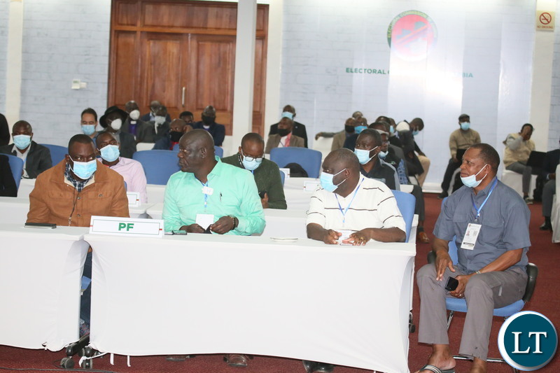 PF party members follow proceeding during the Electoral Commission of Zambia briefing at the National Results Center Mulungushi in Lusak