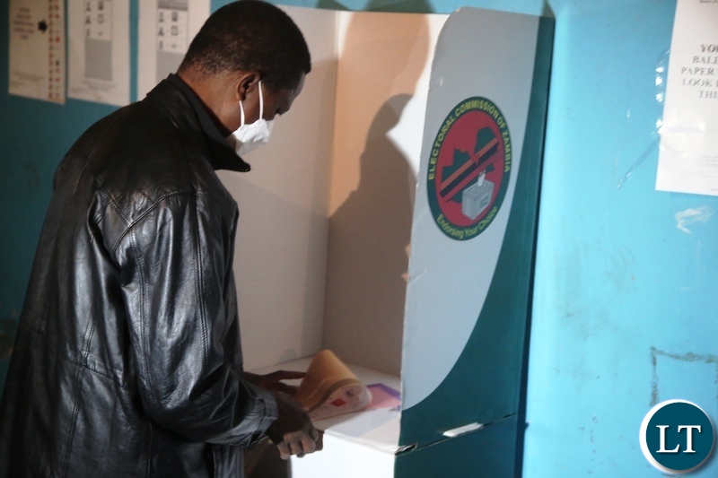 =PRESIDENT Edgar Lungu votes at Andrew stationpolling station in Chawama today.