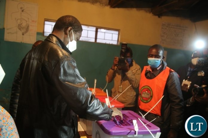 PRESIDENT Edgar Lungu casts his vote at Andrew Mwenya polling station in Chawama today.
