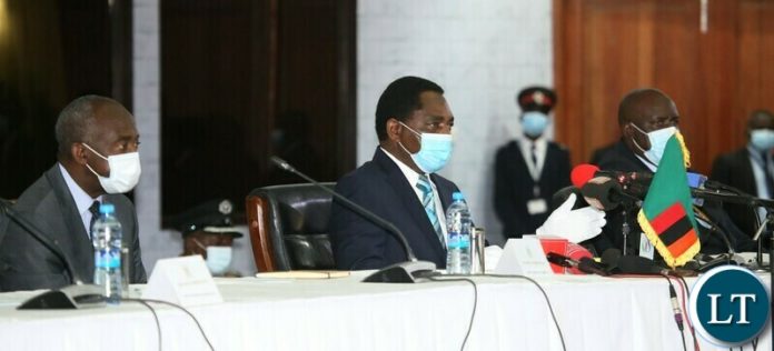 President Hakainde Hichilema (c) Secretary to the Cabinet Dr. Simon Miti (r) and Deputy Secretary to the Cabinet Patrick Kangwa during the induction of Cabinet Ministers and Provincial Ministers at Mulungushi Conference Centre. Monday, September 13, 2021. Picture by ROYD SIBAJENE/ZANIS