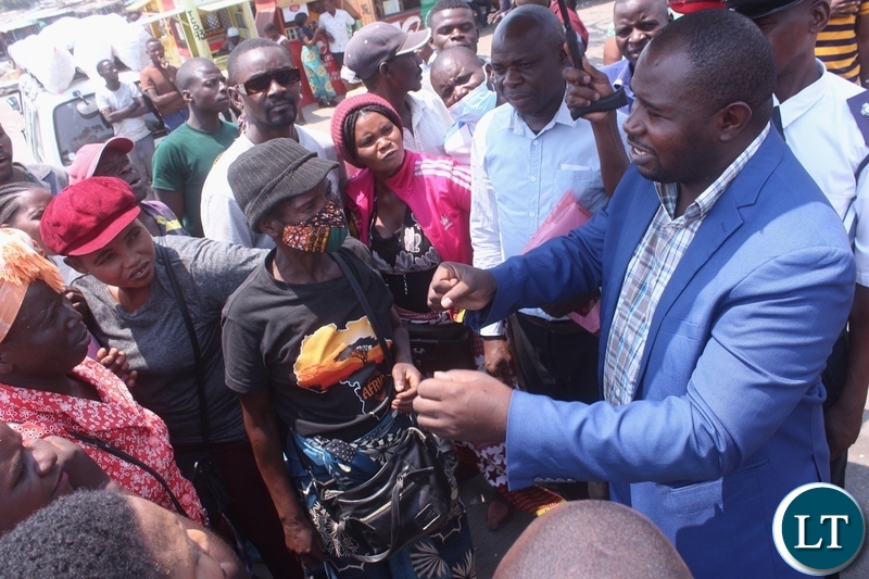Mongu Mayor Nyambe Matakala (blue suit) addressing and assuring traders at Mongu Central Market that his government will construct new markets and will not allow its people to trade in the sun in Mongu Western Province
