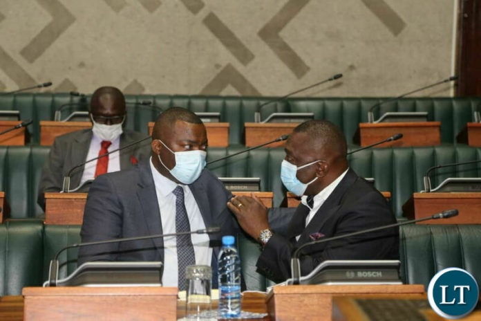 Kabushi Member of Parliament Bowman Lusambo chats with Mazabuka Central Member of Parliament Gary Nkombo at Parliament Buildings Kabushi Member of Parliament Bowman Lusambo chats with Mazabuka Central Member of Parliament Gary Nkombo at Parliament Buildings