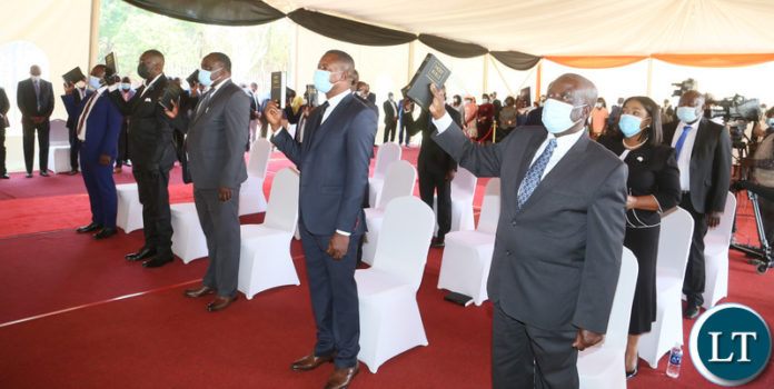 Newly appointed cabinet Ministers taking oath before Hakainde Hichilema during swearing in ceremony at State House