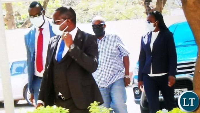 Faith Musonda in the company of her lawyers Makebi Zulu and Jonas Zimba at Zambia Police headquarters. Faith Musonda in the company of her lawyers Makebi Zulu and Jonas Zimba at Zambia Police headquarters.