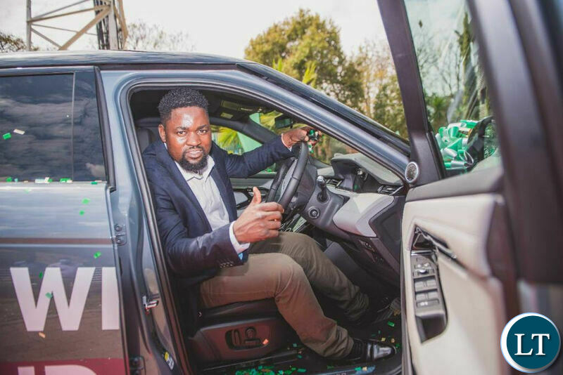 Kelvin Bandela, winner of the Win a Range Rover promotion gets a feel of his new car