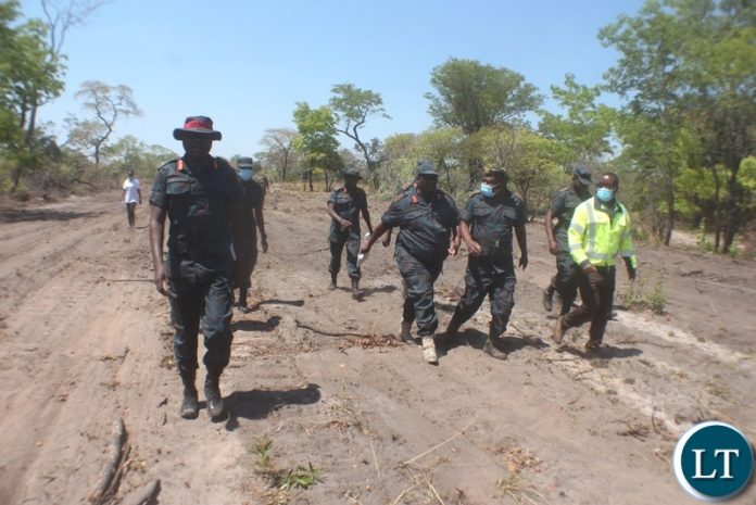 ZNS Commandant Lt. Gen. Maliti Solochi (front) leading his entourage during the inspection of the Kalongola – Nalolo Road Project that has taken too long to complete in Nalolo District, Western Province yesterday. The standard gravel road will connect Sioma, Nalolo and Kalabo Districts.
