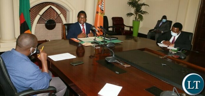 President Hakainde Hichilema answering questions from Radio Phoenix presenter Luciano Hambote during the live radio broadcast at state house whilst Special Assistant to the President for Press and Public relations Anthony Bwalya looks President Hakainde Hichilema answering questions from Radio Phoenix presenter Luciano Hambote during the live radio broadcast at state house whilst Special Assistant to the President for Press and Public relations Anthony Bwalya looks