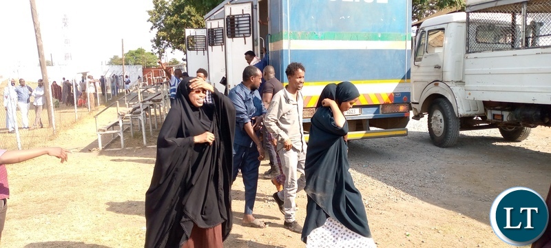 Suspected illegal immigrants arriving at Ndola's Musakasonka Stadium where they were taken for screening after a joint clean-up operation that was undertaken by the department of immigration and other security wings on October 29,2021. 128 illegal immigrants were apprehended and are currently detained at Kansenshi correctional facility in Ndola.