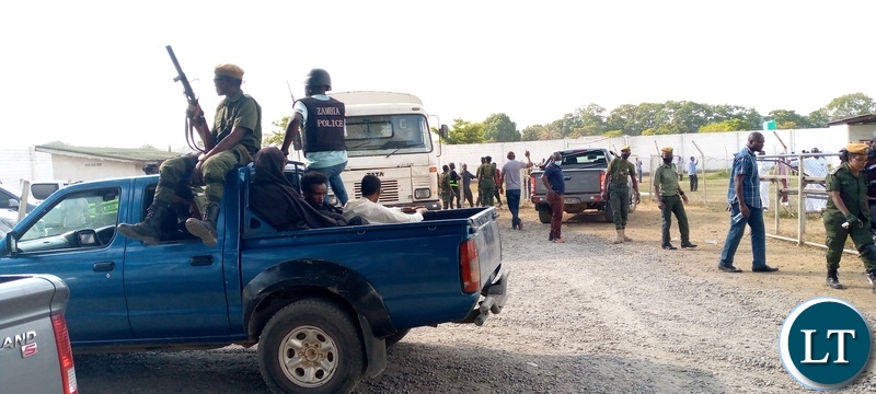 Officers from various security agencies during a joint clean-up operation with the department of Immigration in Ndola district where 128 illegal immigrants were apprehended and detained at Kansenshi correctional facility