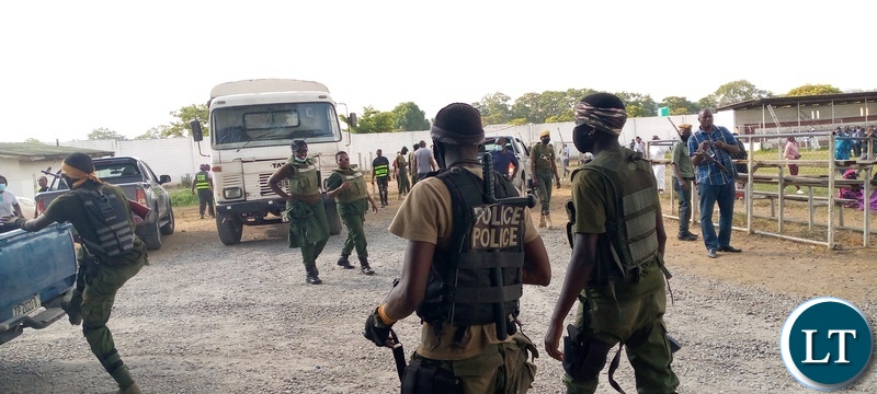 Officers from various security agencies during a joint clean-up operation with the department of Immigration in Ndola district where 128 illegal immigrants were apprehended and detained at Kansenshi correctional facility