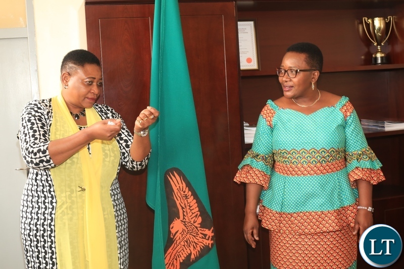 MINISTER of Labour and Social Security,Brenda Tambatamba(right)confers with Zimbabwean High Commissioner to Zambia,Charity Charamba when she paid a courtesy call on her in Lusaka .