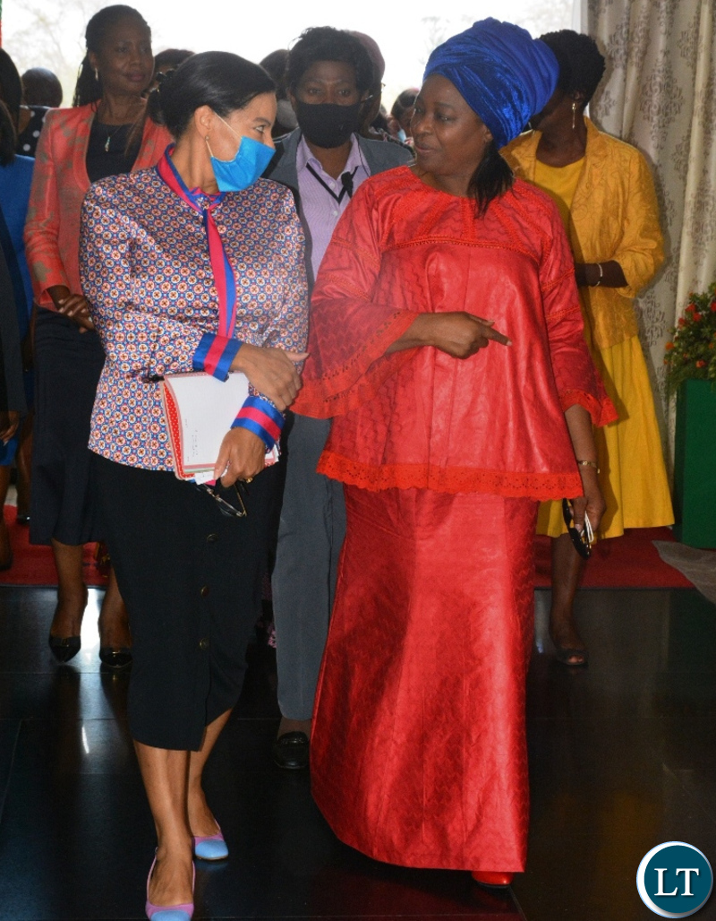 THE First Lady Mutinta Hichilema(r) to the Principal media officer , Marise Haefner when the Minister's spouses met the first Lady at State House in Lusaka.