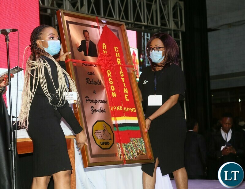 Ushers displays the scarf for bidding during the Gala Dinner and meet the President at Mulungushi Conferance Center