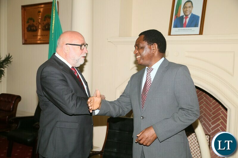 President Hakainde Hichilema having a light moment with Germany special envoy of the chancellor Gunter Nooke and his entourage during the meeting at State House