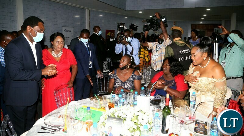 President Hakainde Hichilema greets Minister of Information and Media Chushi Kasanda during the Gala Dinner and meet the President at Mulungushi Conferance Center