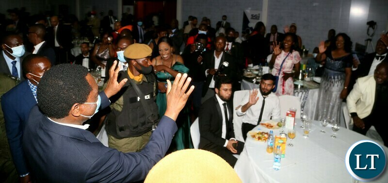President Hakainde Hichilema gestures to the audiance  during the Gala Dinner and meet the President at Mulungushi Conferance Center 