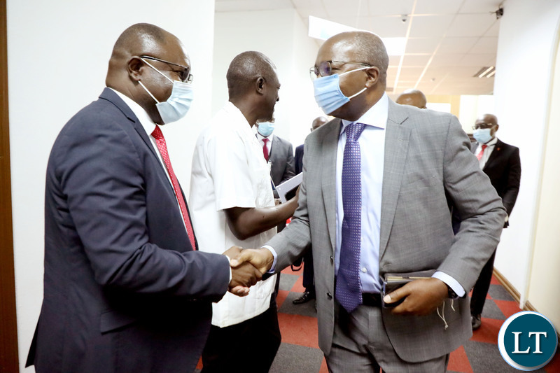 Finance Minister Situmbeko Musokotwane interracts with Bankers Association of Zambia Chief Executive officer Leonard Mwanza (L) shortly after the Post Budget  Townhall Symposium at Mulungushi International Conference Centre in Lusaka on Monday, November 1,2021 -Picture by THOMAS NSAMA/ZANIS  