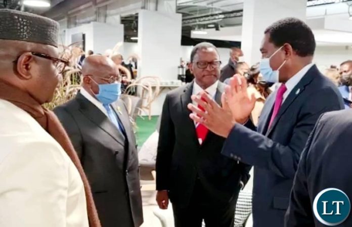 President Hakainde Hichilema meeting with President Nana Akufo-Addo of Ghana while the Malawian President Lazarus Chakwera looks on President Hakainde Hichilema meeting with President Nana Akufo-Addo of Ghana while the Malawian President Lazarus Chakwera looks on