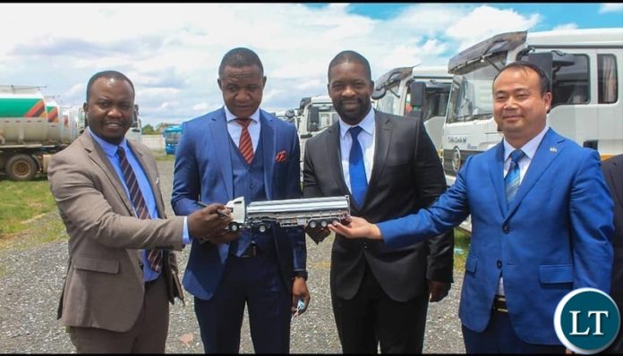 Youth and Sport Minister Elvis Nkandu with Kinglong Company General Manager Wu Ming and Permanent Secretary Chileshe Kangwa