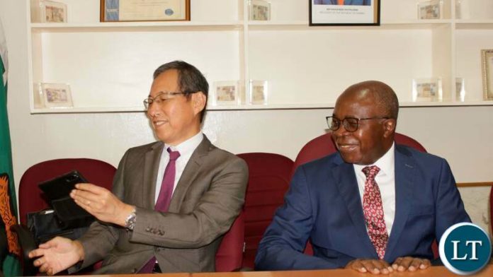 Japanese Ambassador to Zambia and COMESA, Mizuuchi Ryuta and Finance and National Planning Minister Dr. Situmbeko Musokotwane Japanese Ambassador to Zambia and COMESA, Mizuuchi Ryuta and Finance and National Planning Minister Dr. Situmbeko Musokotwane