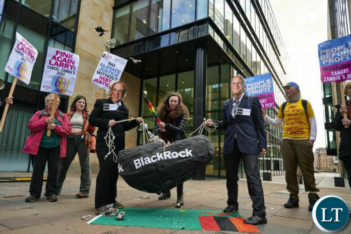 Protesters outside of Blackrock’s Edinburgh office to demanding that the company cancels Zambia's debt. Protesters outside of Blackrock’s Edinburgh office to demanding that the company cancels Zambia's debt.