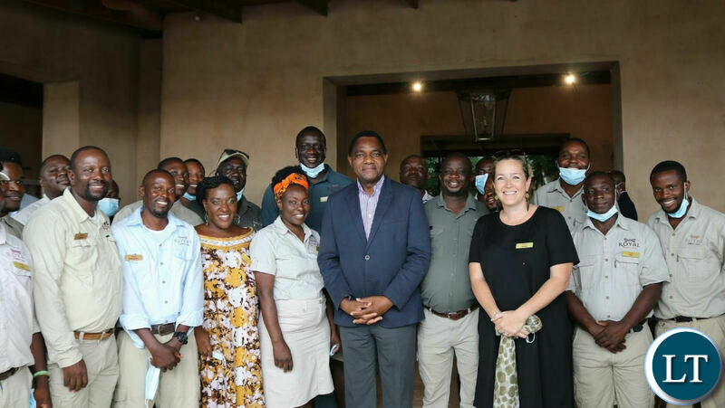 President Hichilema poses with staff at Royal Zambezi Lodge after he attended a meeting organized by the Brenthurst Foundation on AFRICOM.
