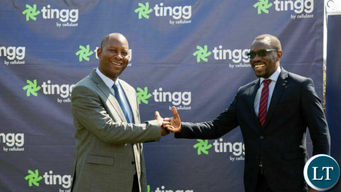 Mike Mposha, Minister of water development and sanitation, with Gilbert Lungu, the country manager for Cellulant Zambia.