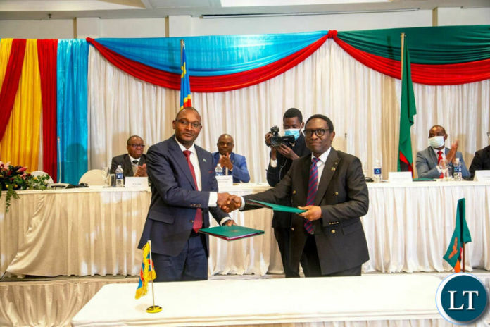 Energy Minister Kapala exchange agreement document with DRC Minister Mukaleng