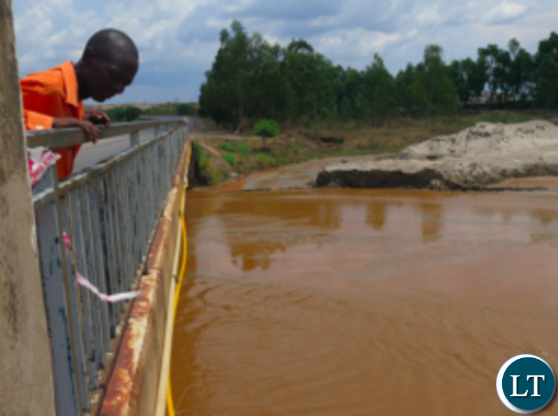 James Nyasulu with polluted River Kafue
