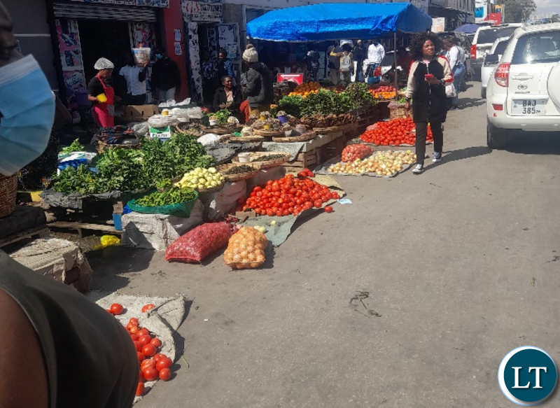 Vendors selling all sorts of goods and services right in the CBD and main roads.