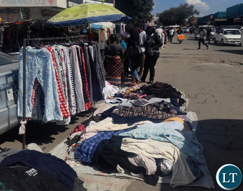 Vendors selling all sorts of goods and services right in the CBD and main roads.