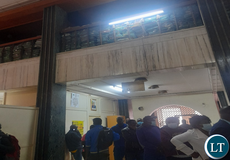 Passport office: Seen here is the chaotic lines and above the paper-based storage taking up the limited space at the facility.