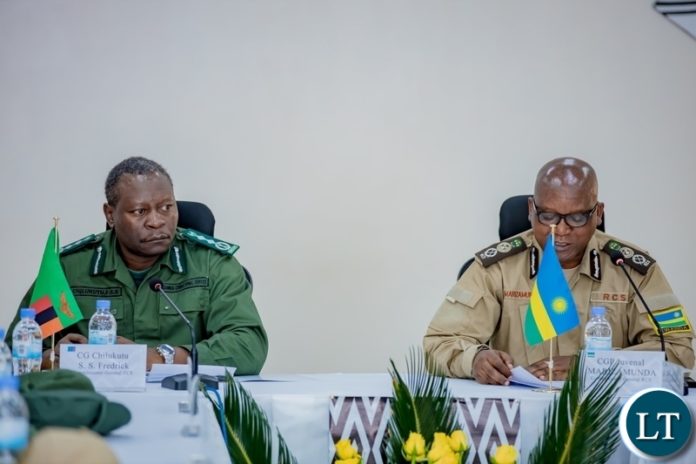 uvenal Marizamunda, Rwanda Correctional Services Commissioner General, and his Zambia counterpart Frederick Chilukutu during a meeting in Kigali on November 28.